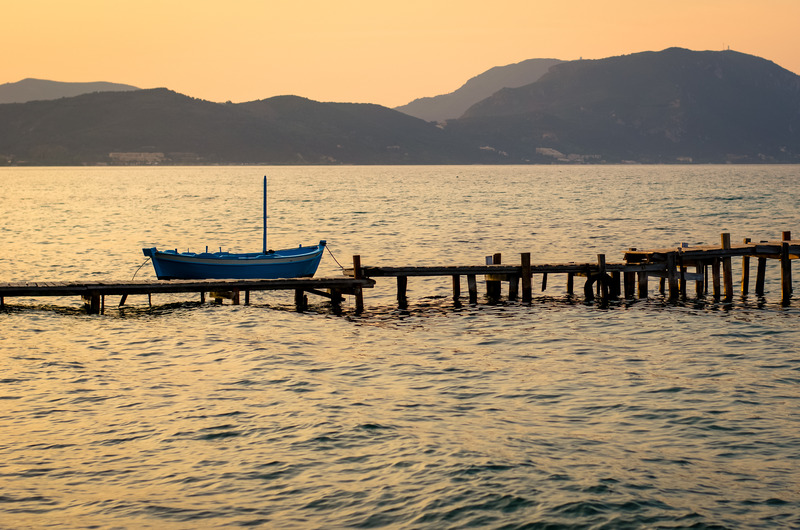 Canvas:  Twilight Tranquility: Greek Fishing Boat at Dusk